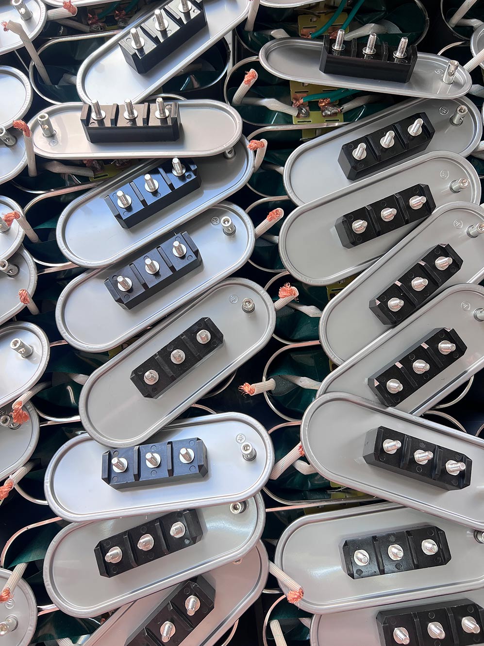 What is the Significance of Torque Values when Connecting Capacitor Power Terminals, and What Are the Risks of Improper Tightening?